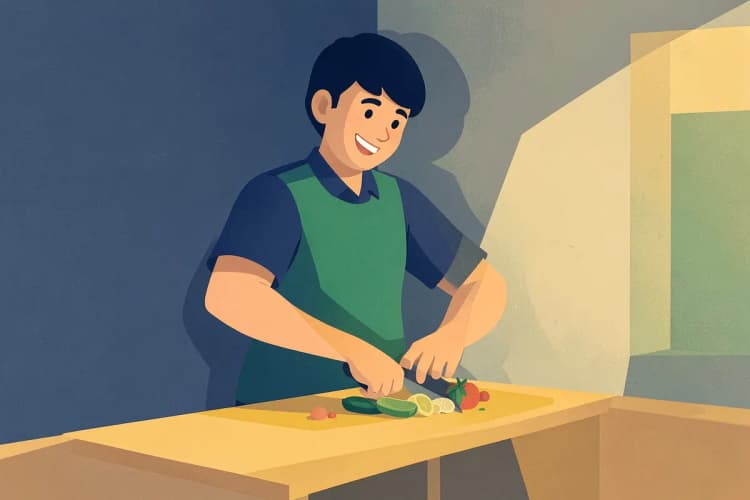 A person happily using a corner worktop in a well-lit kitchen.