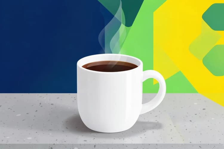 A steaming cup of coffee placed directly on a durable quartz worktop.